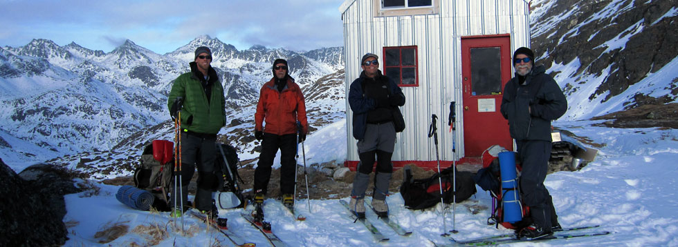 a group of people posing for a picture in the snow