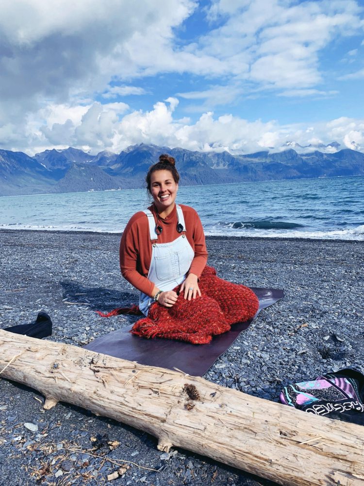 a person standing in front of a body of water